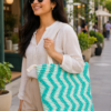 ChatGPT Image Aug 2, 2026, 01_06_21 PM Handwoven Cotton Tote Bag with Blue Geometric Pattern, Bohemian Tassels, and Pom-Poms – Stylish Shoulder Bag for Daily Use, Beach, and Travel