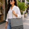 ChatGPT Image Aug 2, 2026, 01_15_47 PM Handwoven Cotton Tote Bag with Blue Geometric Pattern, Bohemian Tassels, and Pom-Poms – Stylish Shoulder Bag for Daily Use, Beach, and Travel