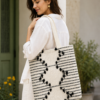 ChatGPT Image Aug 2, 2026, 12_48_08 PM Handwoven Cotton Tote Bag with Blue Geometric Pattern, Bohemian Tassels, and Pom-Poms – Stylish Shoulder Bag for Daily Use, Beach, and Travel